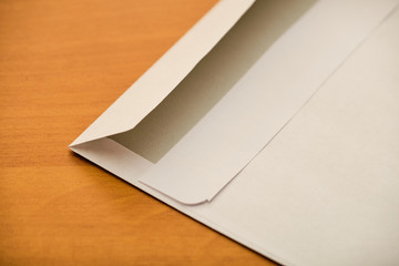 Envelope detail on wooden table