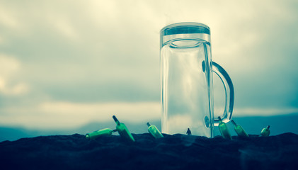 Iron handcuffs for the arrest of criminals, a glass of vodka on a wooden. background. a crime committed while intoxicated.
