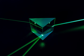 Laser beam and optical glass on black background