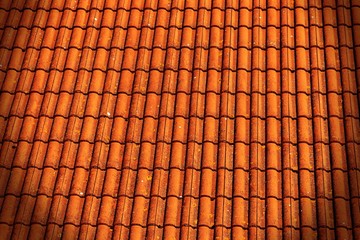 Red brick roof tiles background with vignette