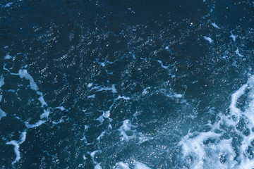 Texture of Black Sea. Blue frothy surface of sea water. Background shot of aqua sea water surface. Marine concept.