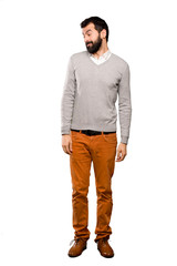 Fototapeta premium Handsome man making doubts gesture looking side over isolated white background