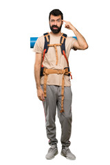 Fototapeta premium Hiker man making the gesture of madness putting finger on the head over isolated white background
