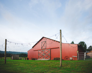 Fototapeta na wymiar Old Red Barn under an Alabama summer sun