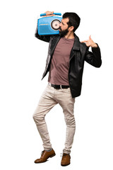 Handsome man with beard holding a radio