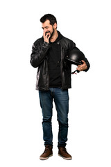 Full-length shot of Biker man smiling a lot over isolated white background