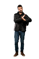 Full-length shot of Biker man making NO gesture over isolated white background
