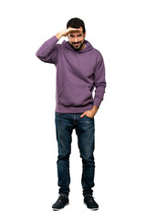 Fototapeta premium Full-length shot of Handsome man with sweatshirt looking far away with hand to look something over isolated white background