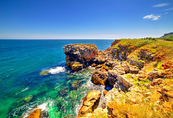 Stunningly beautiful landscape with rocky shore and blue sea