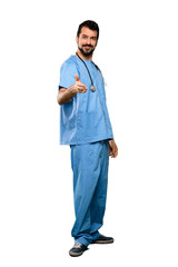 Full-length shot of Surgeon doctor man shaking hands for closing a good deal over isolated white background