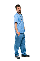 Full-length shot of Surgeon doctor man smiling over isolated white background