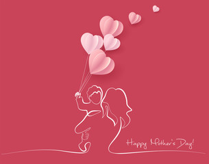 Woman hold her baby with air balloons