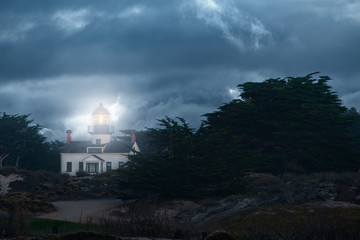 Dramatic nighttime photograph of Point Pinos lighthouse in Pacific Grove California.
