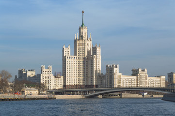 Fototapeta na wymiar Kotelnicheskaya Embankment Building with bridge and Moskva river