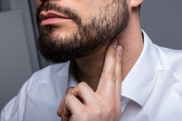 Man Touching His Neck To Control Blood Pressure