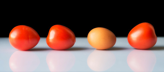 Three tomatoes and one egg