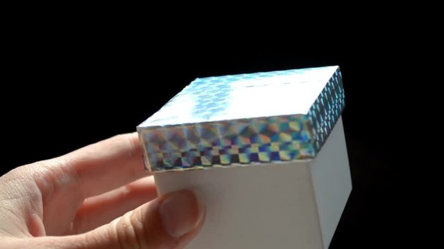 White gift box with rainbow scotch cover, DIY idea, the box is opened by hand