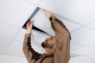 Electrician Installing Ceiling