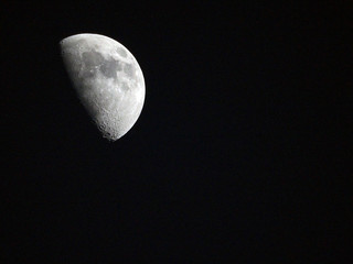 Half-Moon on black sky .