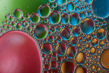 colored oil drops on water