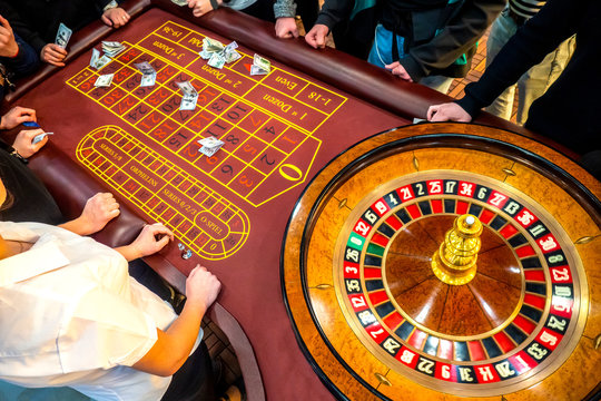 Roulette table from the top. Casino. People make bets on roulette. Money betting Gambling in the United States of America. People play gambling.