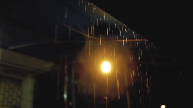 Old lamp on the ceiling in the rain dark night