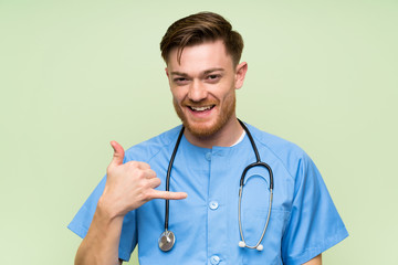 Surgeon doctor man making phone gesture