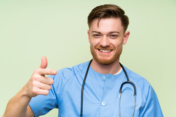 Surgeon doctor man points finger at you
