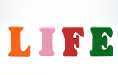 English word life of colorful wooden letters on a white background