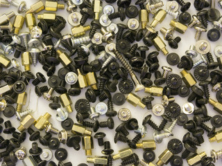 Many bolts and screws of different colors