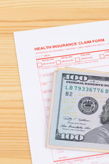 Health insurance claim form on wooden desk