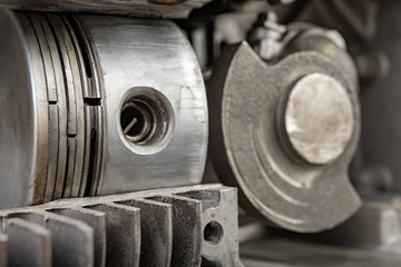 A four-stroke gasoline engine in section. The interior of a single-cylinder internal combustion engine.