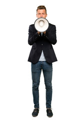 Fototapeta premium Blonde handsome man shouting through a megaphone