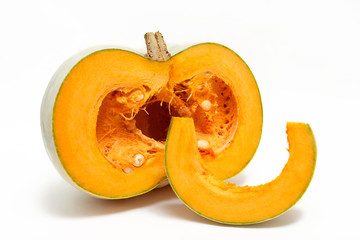 A group of one half and one slice of fresh pumpkin isolated on a white background. Close-up.