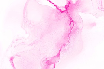 Pink alcohol ink texture with abstract washes and paint stains on the white paper background.	