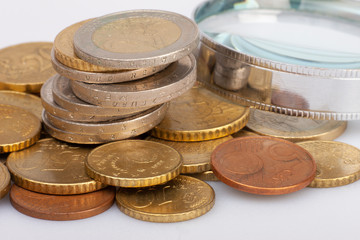 Euro coins stacked on each other in different positions. Selective focus