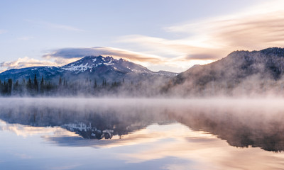 Beautiful Colorful Sunrise Over Snow Peaks on a Hike near an Alpine Lake in Oregon