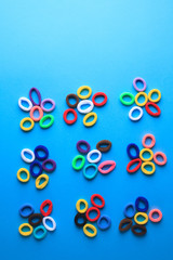 Photo of multi-colored hair elastics in the form of flowers