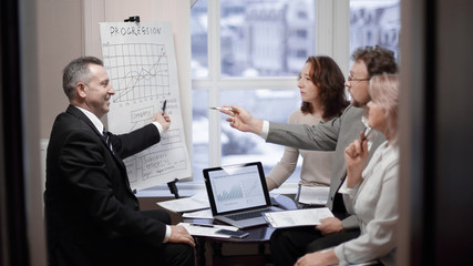 group of senior businessmen discussing a new business project.