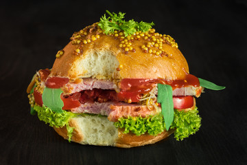 Sandwich with pork and fresh vegetables and greens