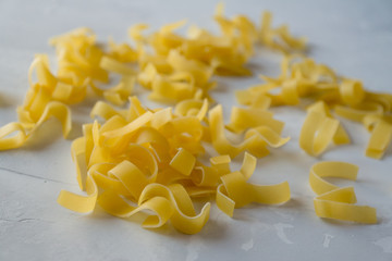 pasta scattered on a gray background
