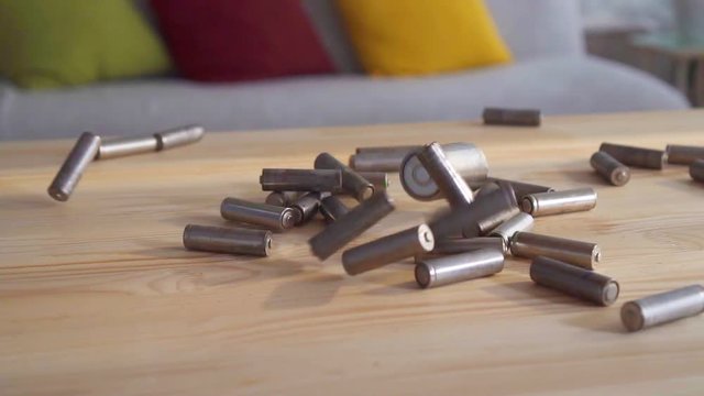 Falling used batteries close-up of slow mo
