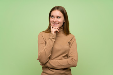 Young woman with turtleneck sweater looking to the side