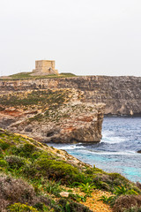 View of the Comino Island coastline with St. Mary's Tower, Comino Island, Malta