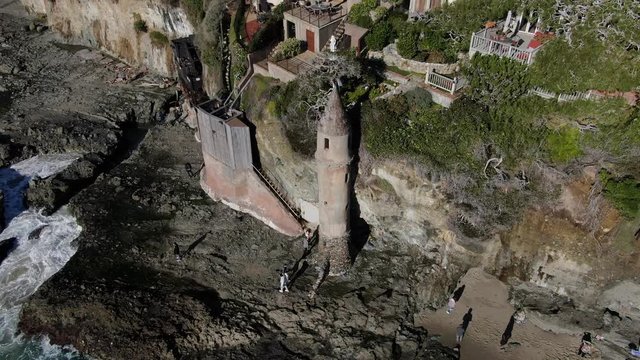 Coastal cliff side town & tower aerial view