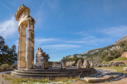 Ruins of Athena pronaia temple in Delphi with snow