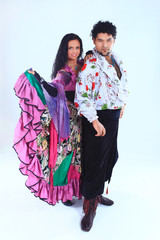 portrait of a beautiful dancing couple in a Gypsy costume.i