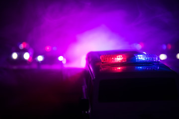 Police cars at night. Police car chasing a car at night with fog background. 911 Emergency response pSelective focus © zef art