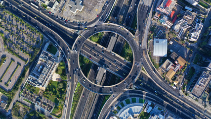 Aerial drone photo of multilevel highway junction urban ring crossing road during rush hour - obrazy, fototapety, plakaty