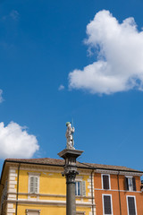 Fototapeta na wymiar The piazza del Popolo with the statues of saints Saint Appolinaris.
